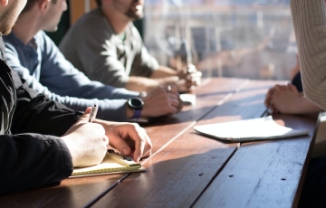 People in a meeting around a table